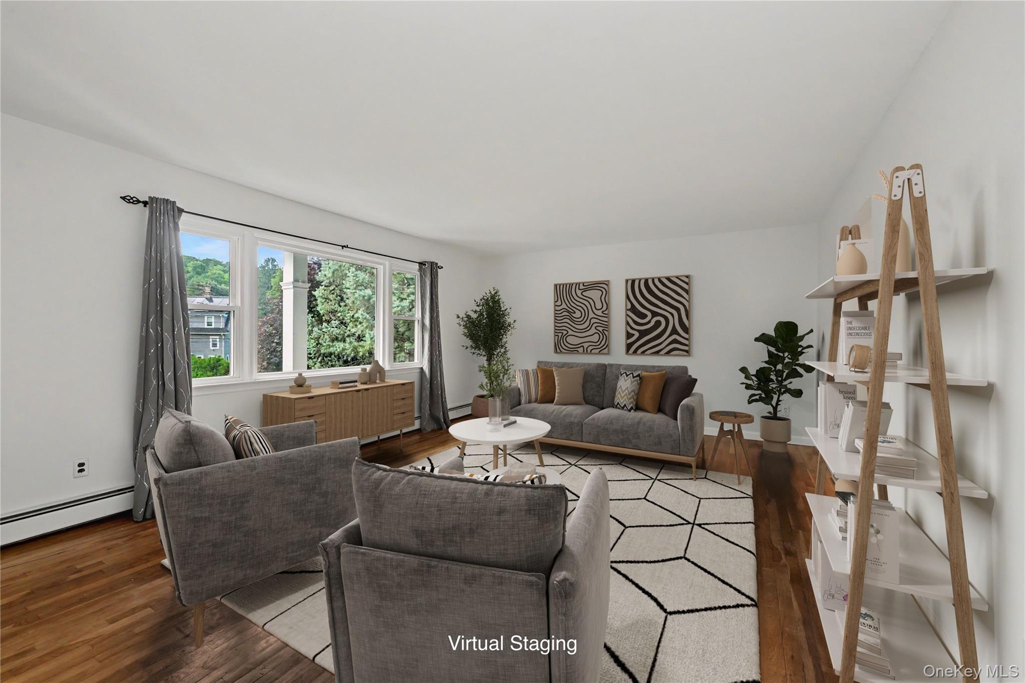 568 Manville Road, Unit UPPER R Pleasantville, NY 10570 - Photo 3 of 32 Virtually staged Light-filled living space featuring wood-finish flooring, white walls, and a multi-pane window