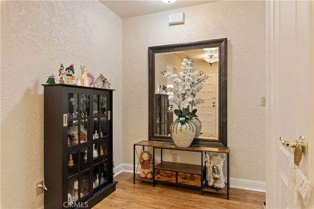 a spacious bedroom with a bed and a flat screen tv