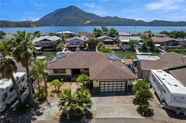 a view of a swimming pool with lounge chairs in patio
