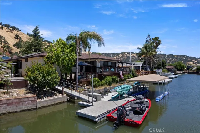 an aerial view of a house with a lake view