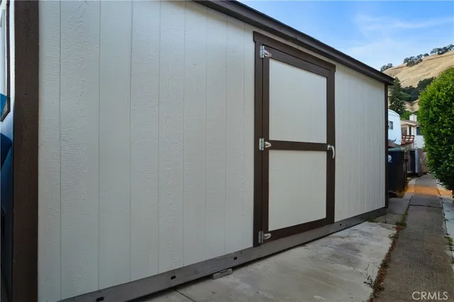 a view of a balcony with wooden floor and lake view