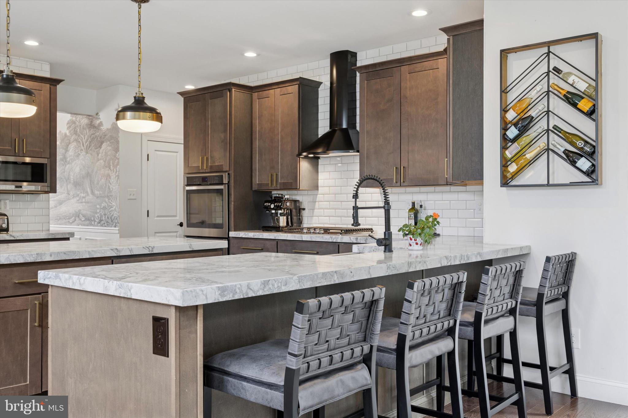 1444 Telegraph Road West Chester, PA 19380 - Photo 14 of 63 a kitchen with a table chairs refrigerator and microwave