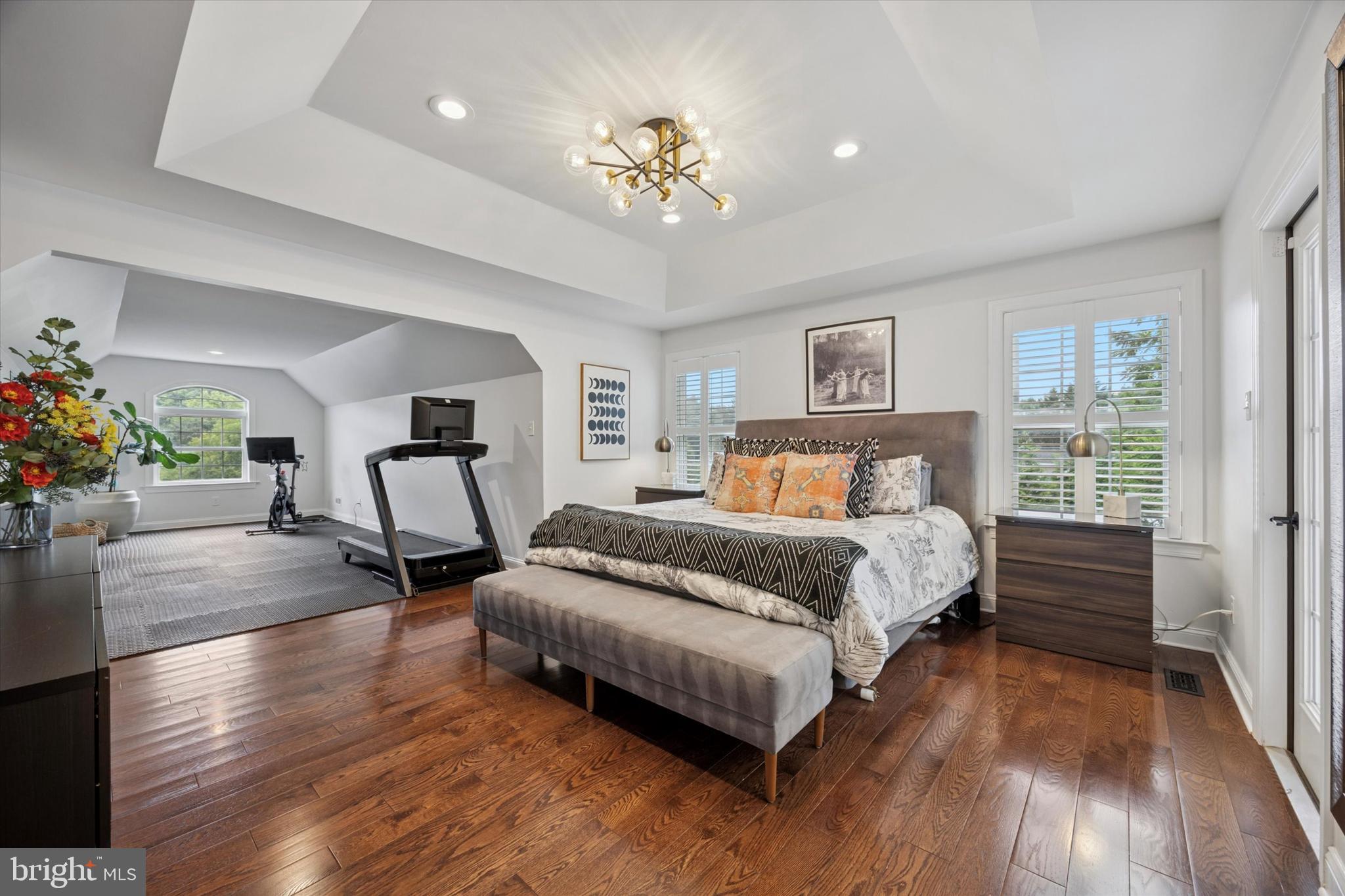 1444 Telegraph Road West Chester, PA 19380 - Photo 26 of 63 a spacious bedroom with a bed and a chandelier