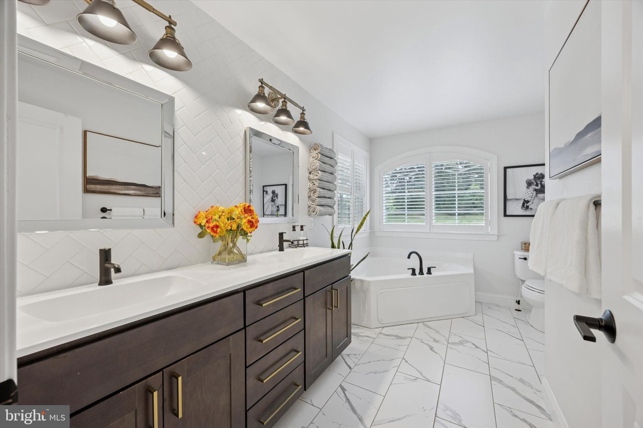 1444 Telegraph Road West Chester, PA 19380 - Photo 30 of 63 a bathroom with a sink double vanity tub shower and a mirror