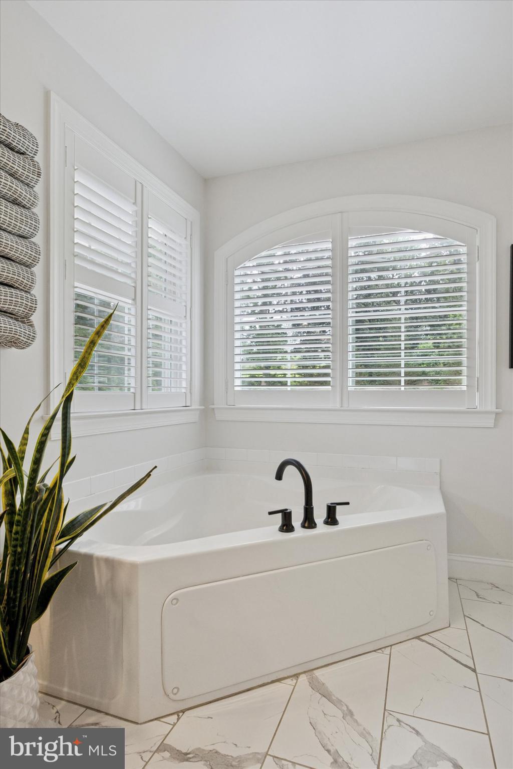 1444 Telegraph Road West Chester, PA 19380 - Photo 31 of 63 a bath tub sitting in a bathroom next to a window