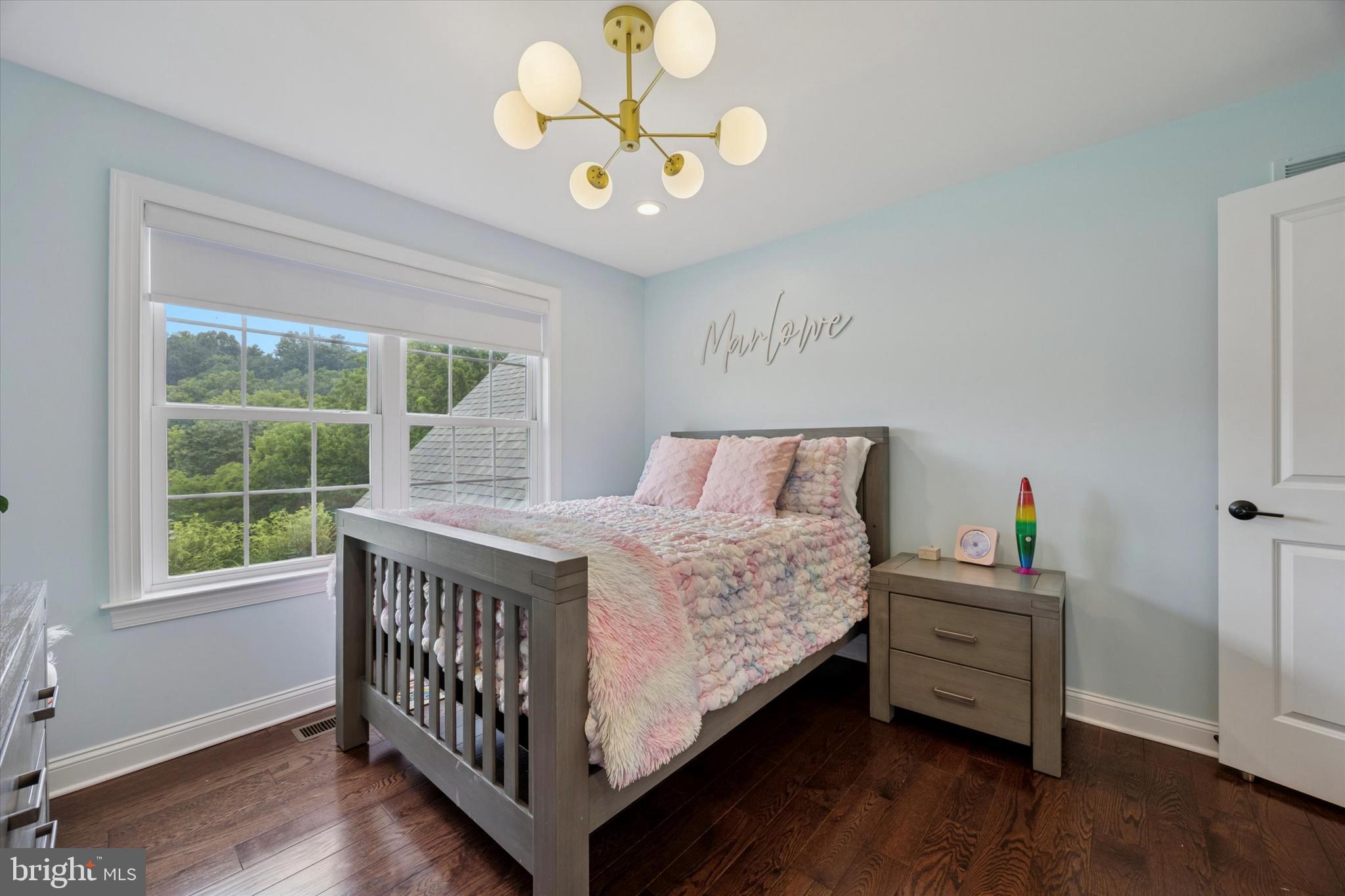 1444 Telegraph Road West Chester, PA 19380 - Photo 43 of 63 a bedroom with a bed and a chandelier