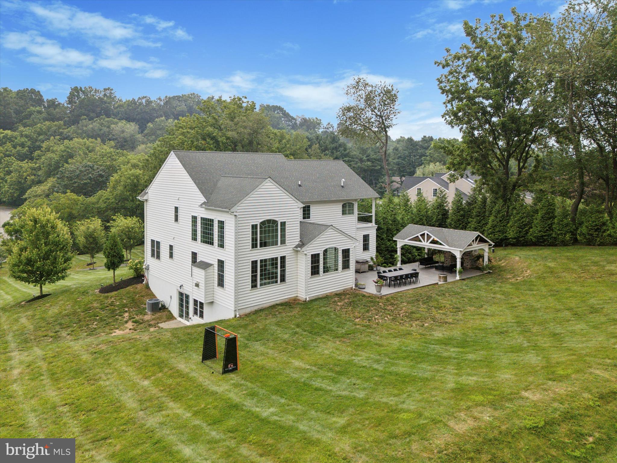 1444 Telegraph Road West Chester, PA 19380 - Photo 55 of 63 a white house sitting in middle of the middle of a field