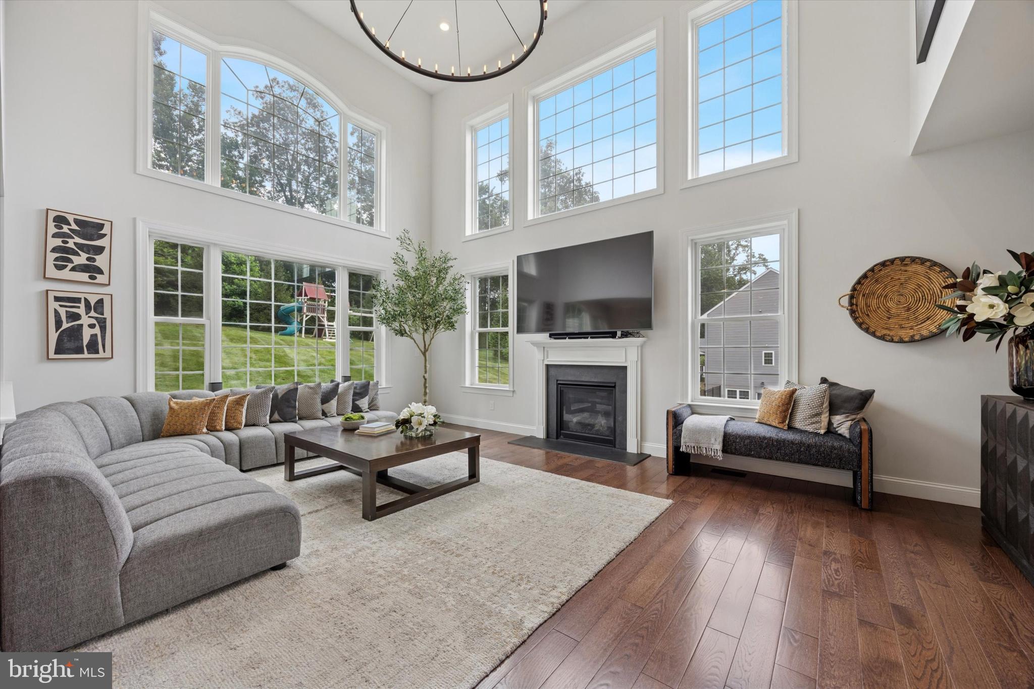 1444 Telegraph Road West Chester, PA 19380 - Photo 9 of 63 a living room with furniture a fireplace and a large window