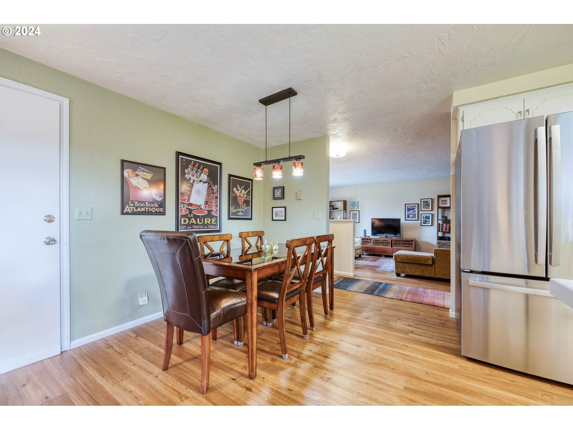 3672 Harlow Road Eugene, OR 97401 - Photo 13 of 36 a view of a dining room with furniture window and wooden floor