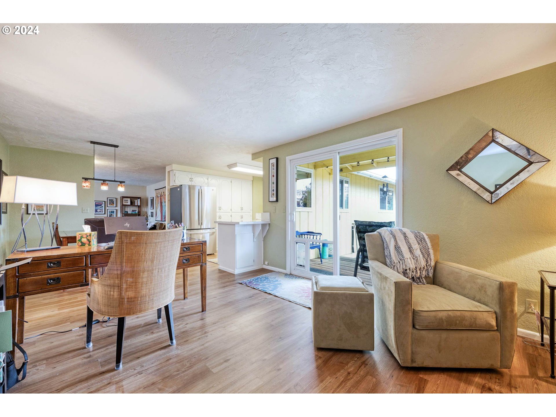 3672 Harlow Road Eugene, OR 97401 - Photo 16 of 36 a living room with furniture and a wooden floor