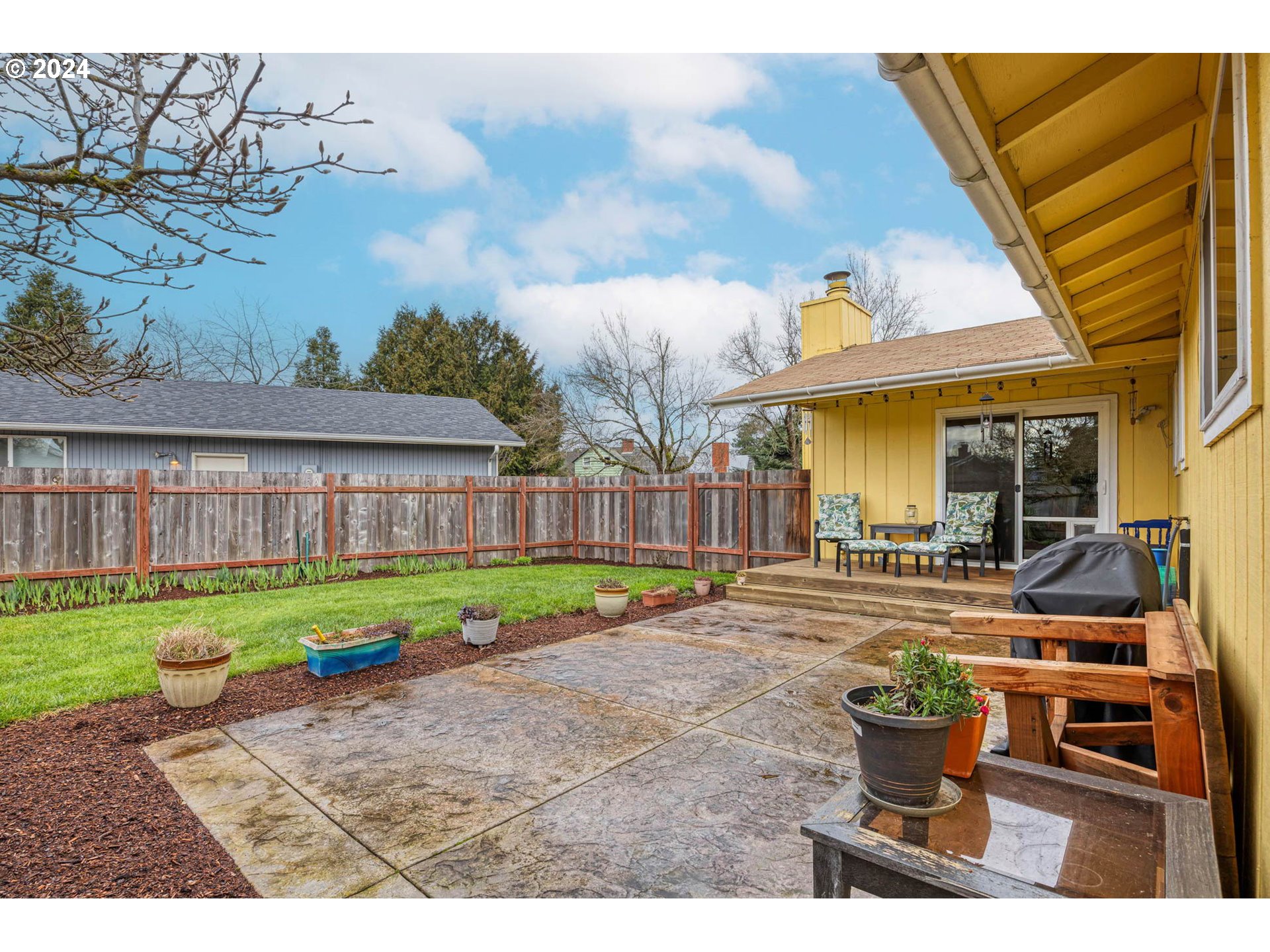 3672 Harlow Road Eugene, OR 97401 - Photo 23 of 36 a view of a house with garden and sitting area