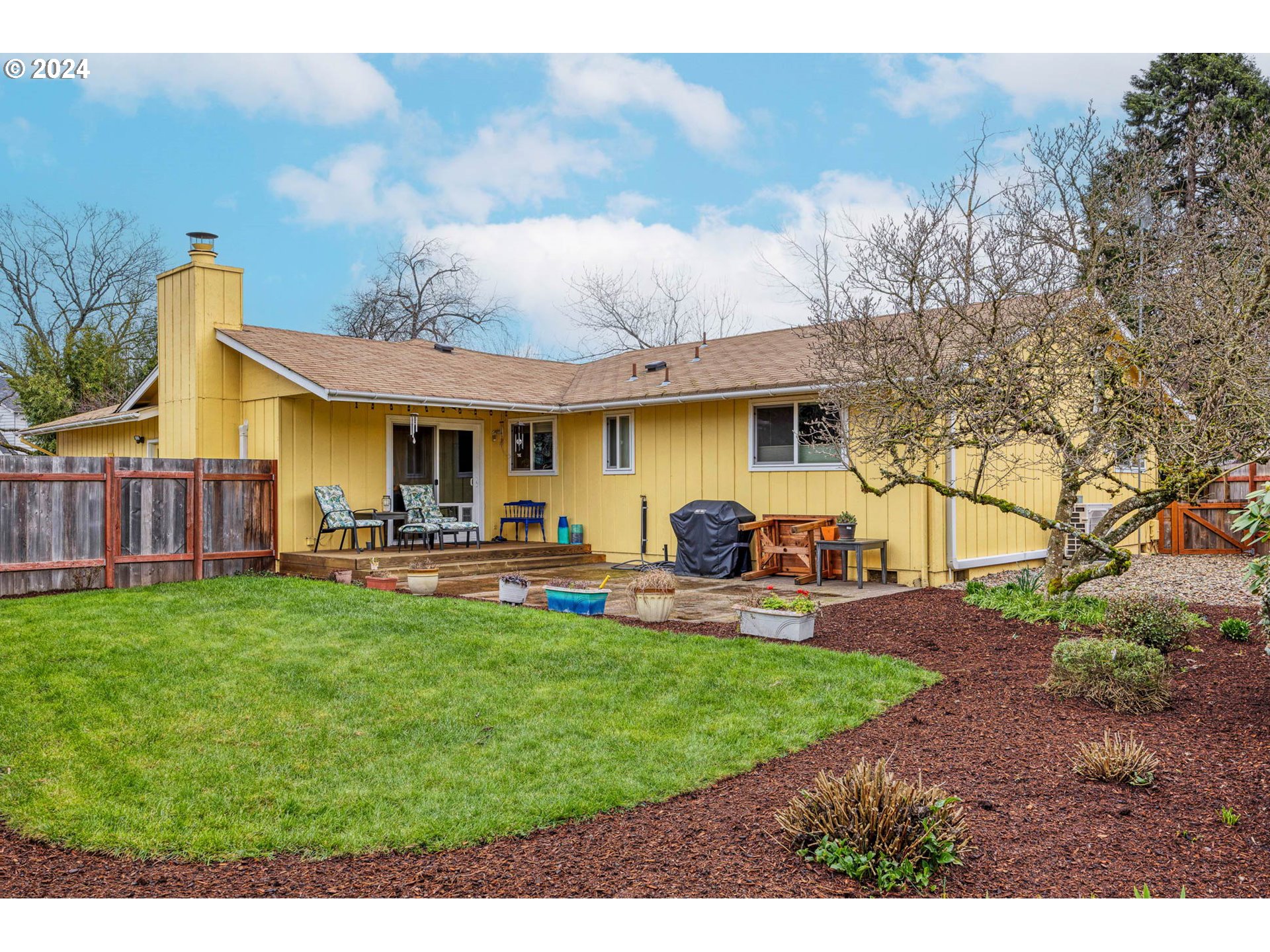 3672 Harlow Road Eugene, OR 97401 - Photo 25 of 36 a view of a house with backyard porch and sitting area