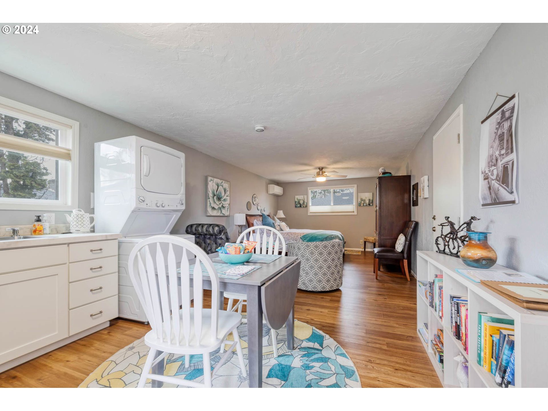 3672 Harlow Road Eugene, OR 97401 - Photo 30 of 36 a living room with furniture a flat screen tv and a table