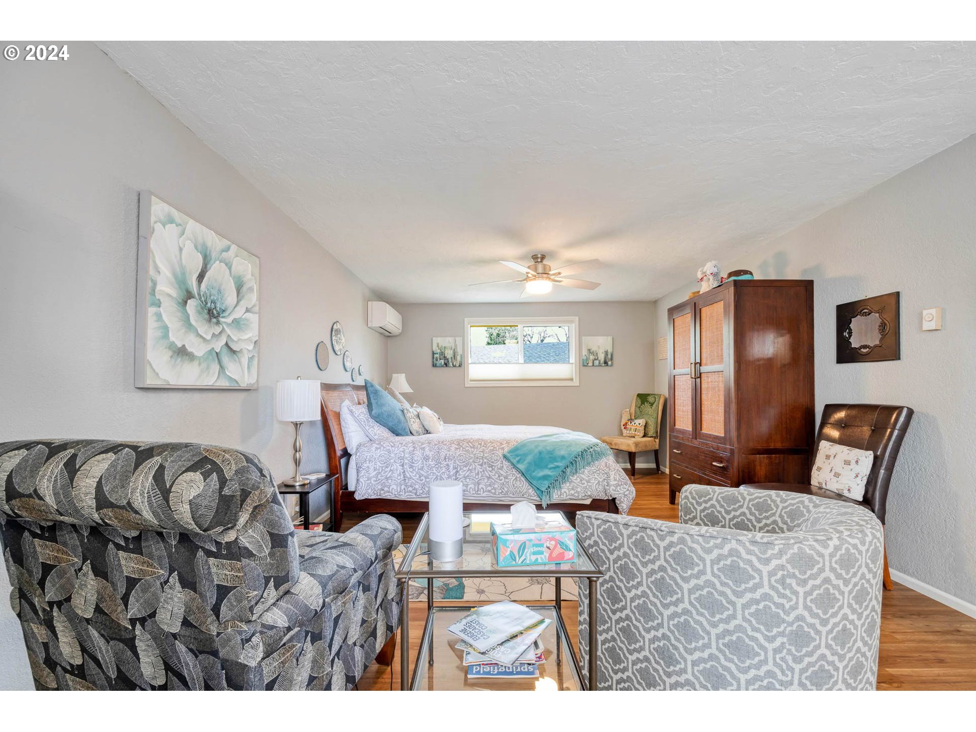 3672 Harlow Road Eugene, OR 97401 - Photo 31 of 36 a bedroom with furniture and wooden floor