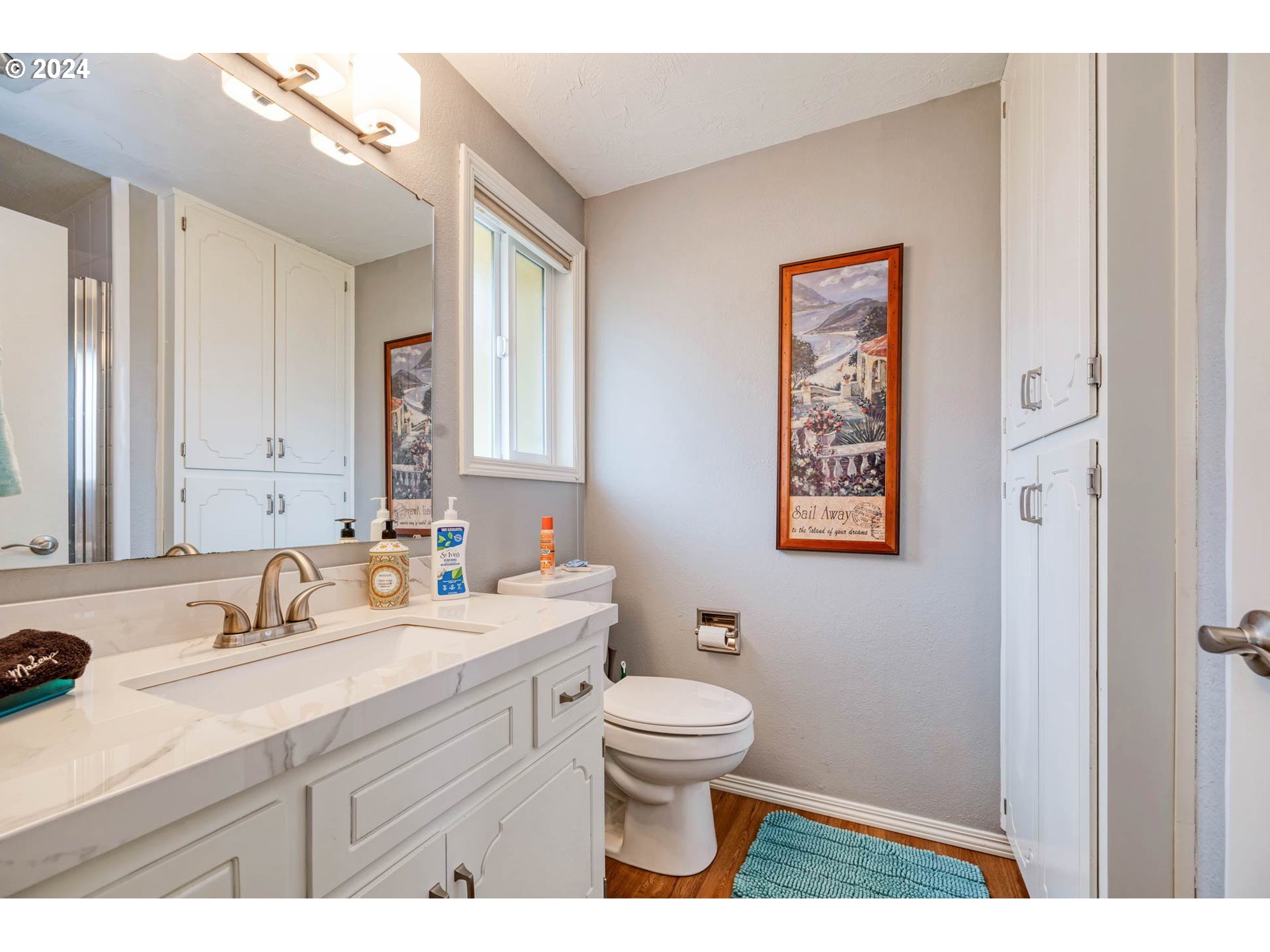 3672 Harlow Road Eugene, OR 97401 - Photo 34 of 36 a bathroom with a sink mirror vanity and toilet