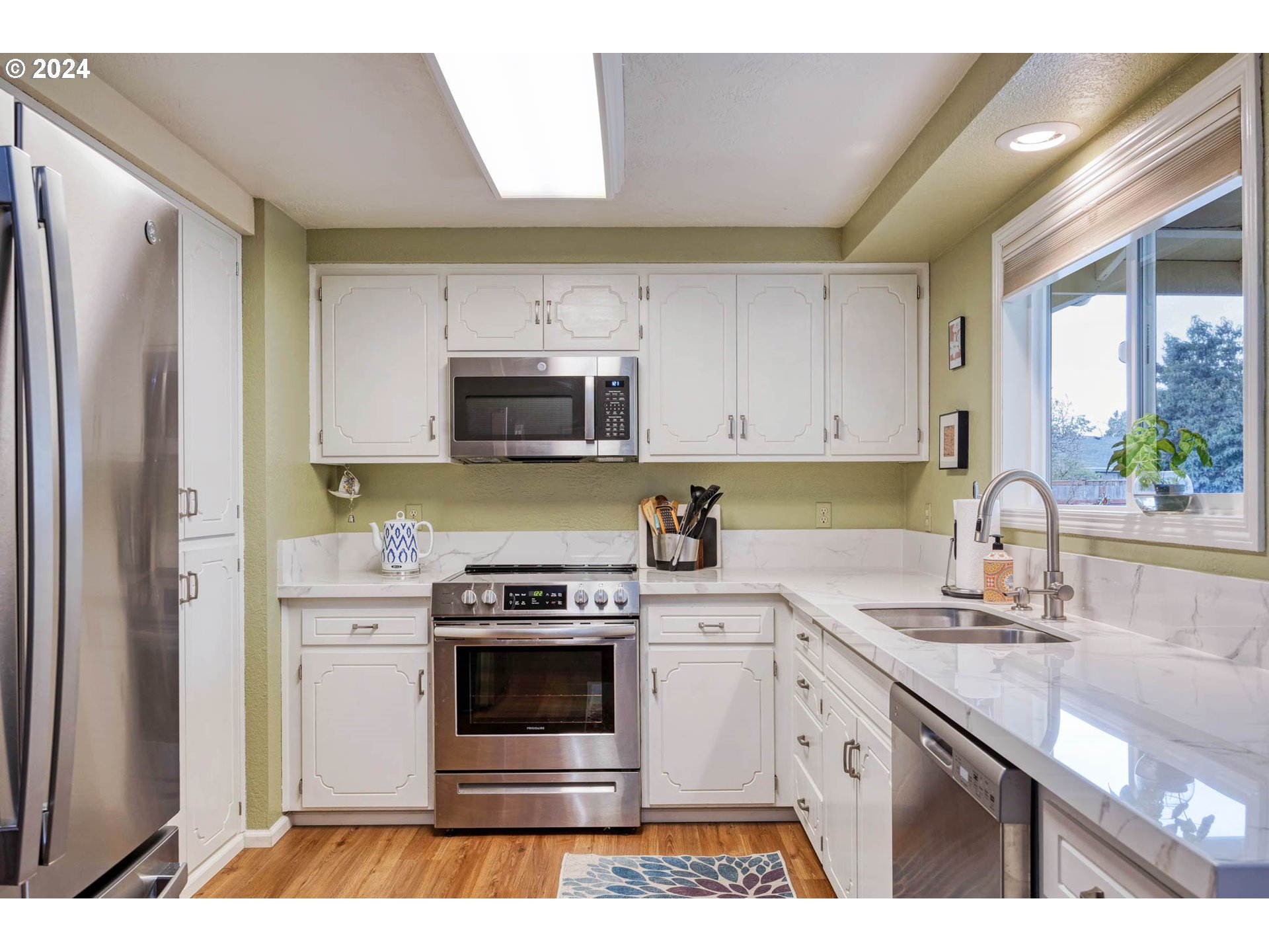 3672 Harlow Road Eugene, OR 97401 - Photo 8 of 36 a kitchen with stainless steel appliances granite countertop a sink stove and refrigerator