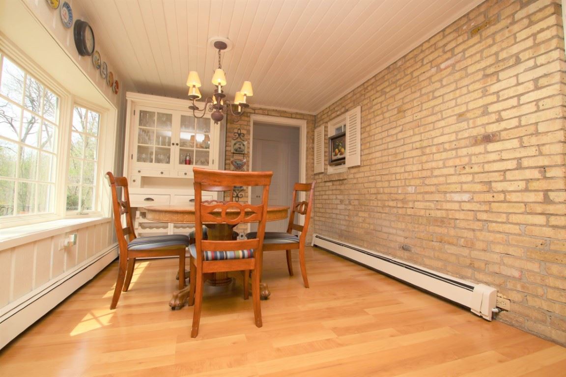 2903 Spring Creek Road Rockford, IL 61107 - Photo 15 of 39 a dining room with furniture and chandelier