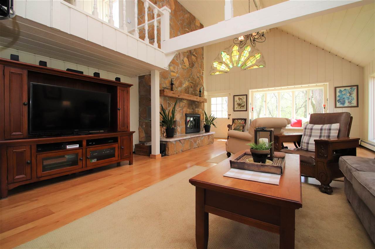 2903 Spring Creek Road Rockford, IL 61107 - Photo 20 of 39 a living room with furniture and a flat screen tv