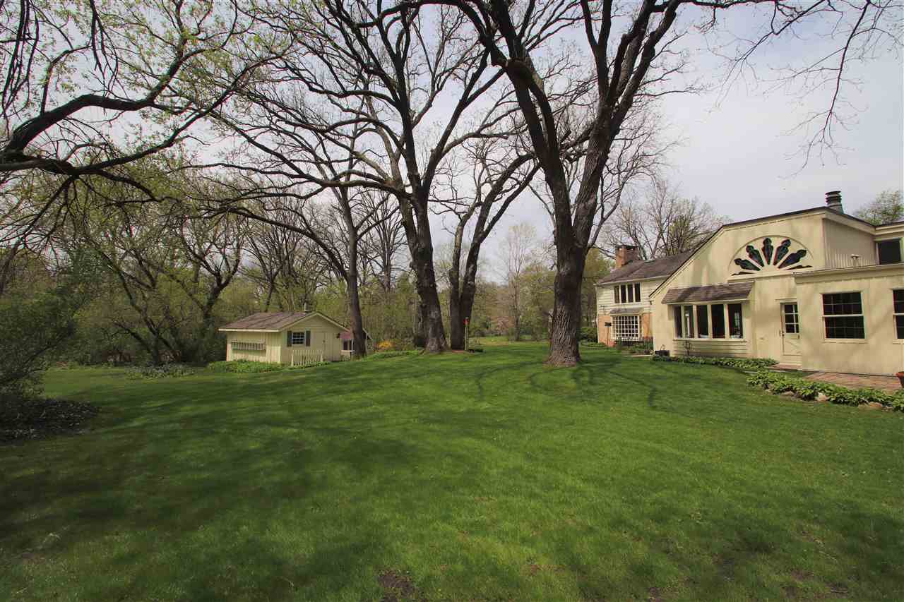 2903 Spring Creek Road Rockford, IL 61107 - Photo 38 of 39 a view of a yard with a house in the background