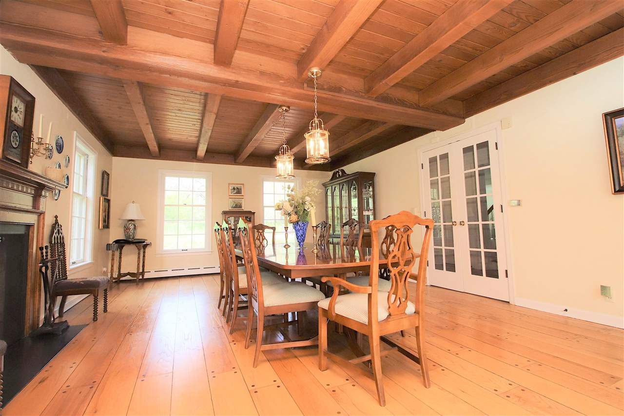 2903 Spring Creek Road Rockford, IL 61107 - Photo 7 of 39 a view of a dining room with furniture wooden floor and a chandelier