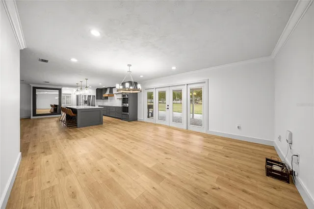a view of kitchen with furniture and wooden floor