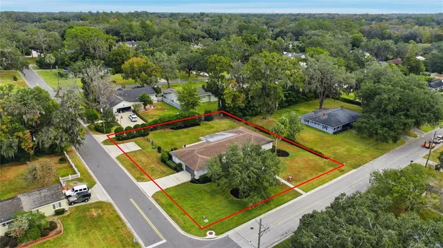 an aerial view of a house with a swimming pool