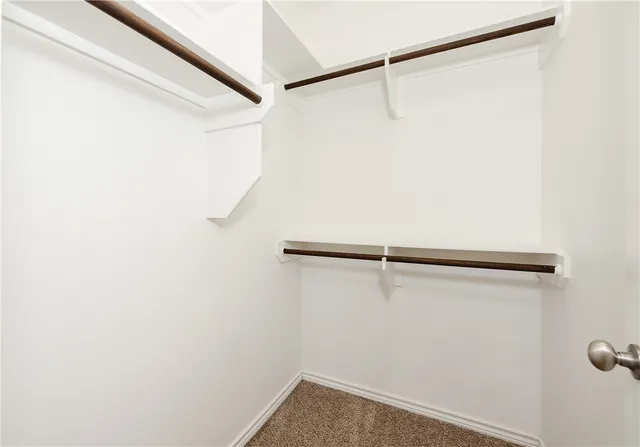 a bathroom with a granite countertop sink a toilet and a bathtub