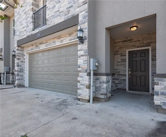 a view of an empty room with brick wall