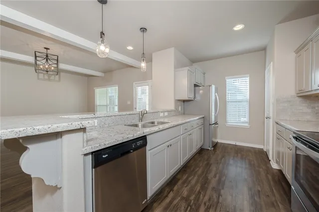 a large kitchen with a lot of counter space
