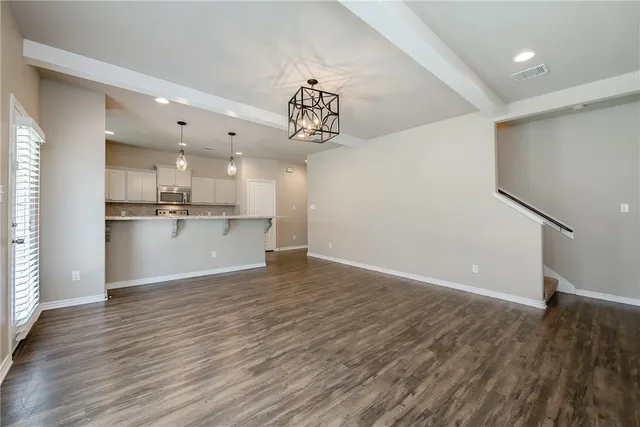 a view of kitchen with wooden floor and window