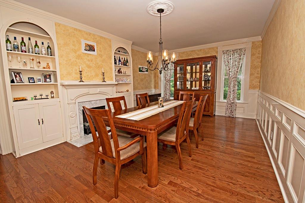 354 Scott Ridge Road Harmony, PA 16037 - Photo 6 of 22 Formal dining room with built ins, decorative fireplace,wainscoting and hardwood floors.
