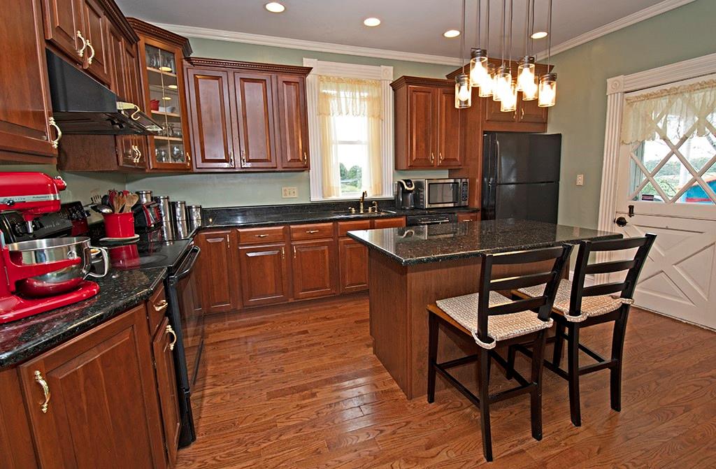 354 Scott Ridge Road Harmony, PA 16037 - Photo 7 of 22 Updated kitchen with granite, cherry cabinetry and pantry. Door to the Wrap porch.
