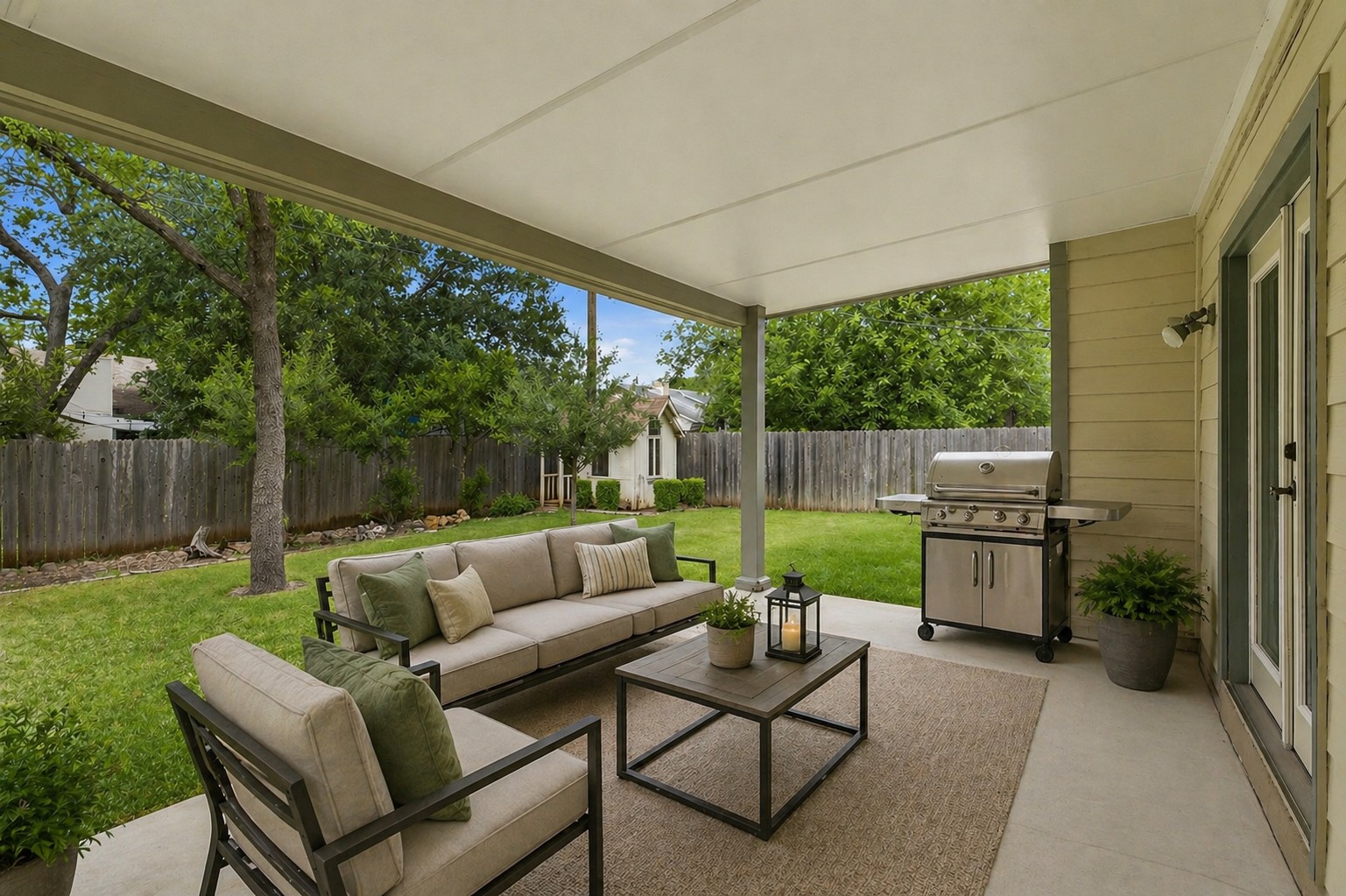5305 Wolf Run Austin, TX 78749 - Photo 13 of 37 Covered concrete patio extending into a fenced grassy yard