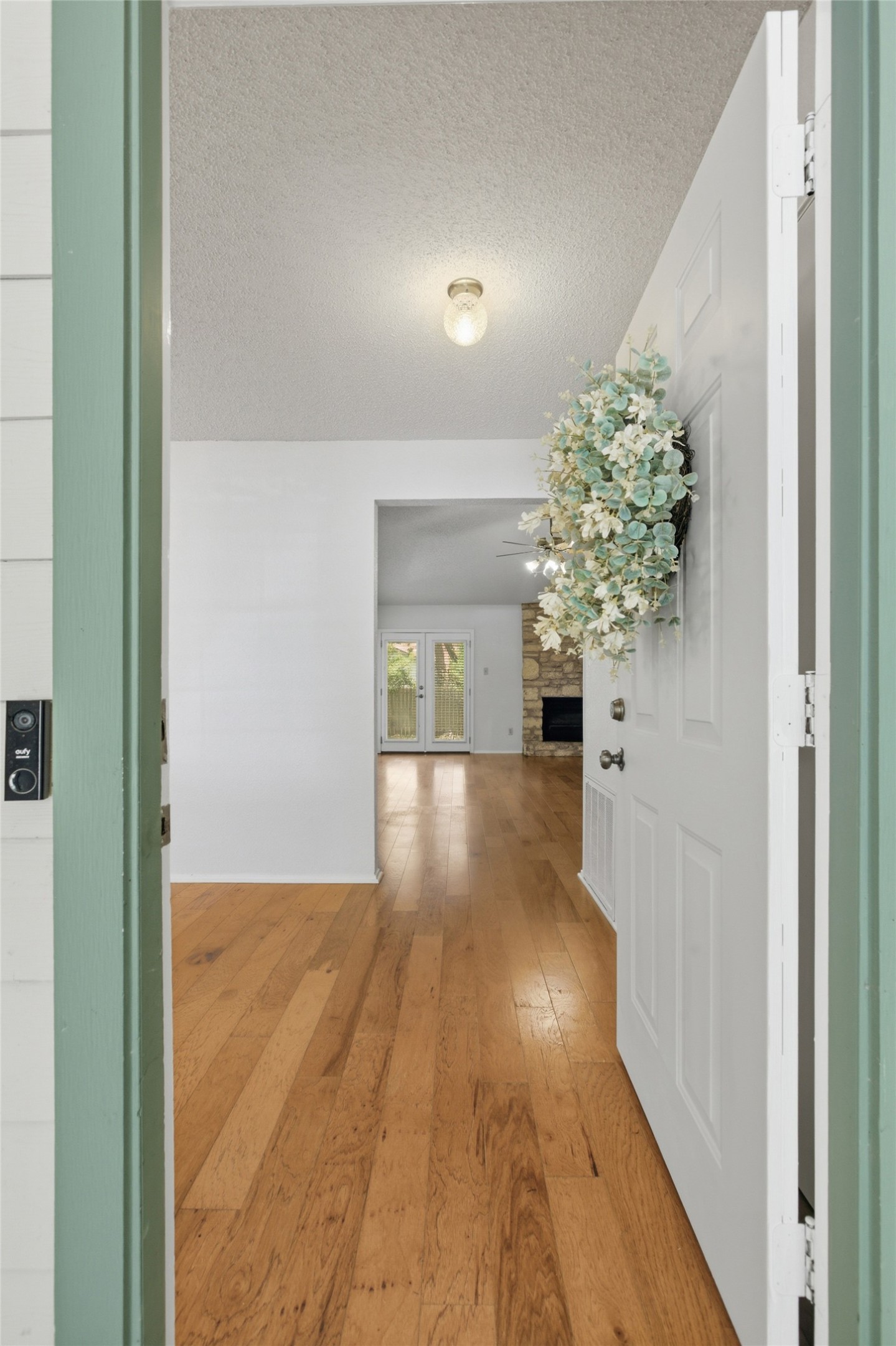 5305 Wolf Run Austin, TX 78749 - Photo 17 of 37 Wide plank wood-finish flooring extends through the entryway and main living area