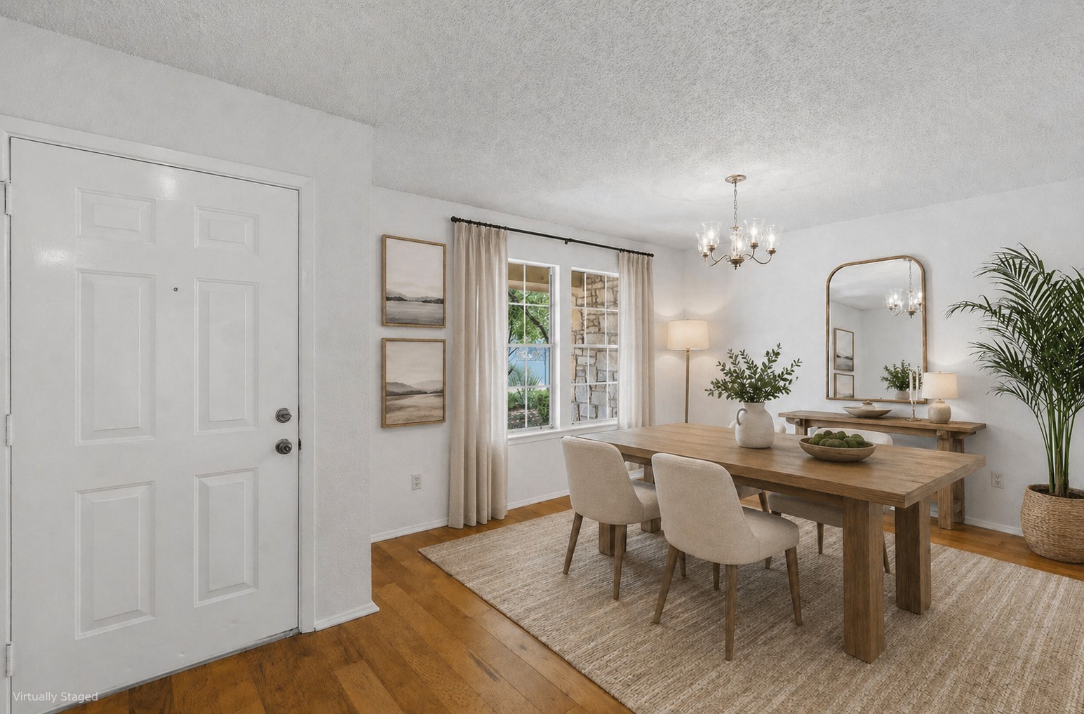 5305 Wolf Run Austin, TX 78749 - Photo 3 of 37 Bright dining area featuring wood-finish flooring, a contemporary chandelier, large window with natural light, and a textured area rug