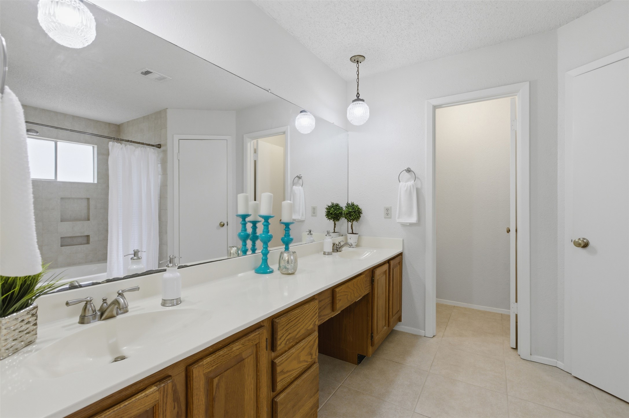 5305 Wolf Run Austin, TX 78749 - Photo 34 of 37 Double vanity with wood-finish cabinetry and white countertop
