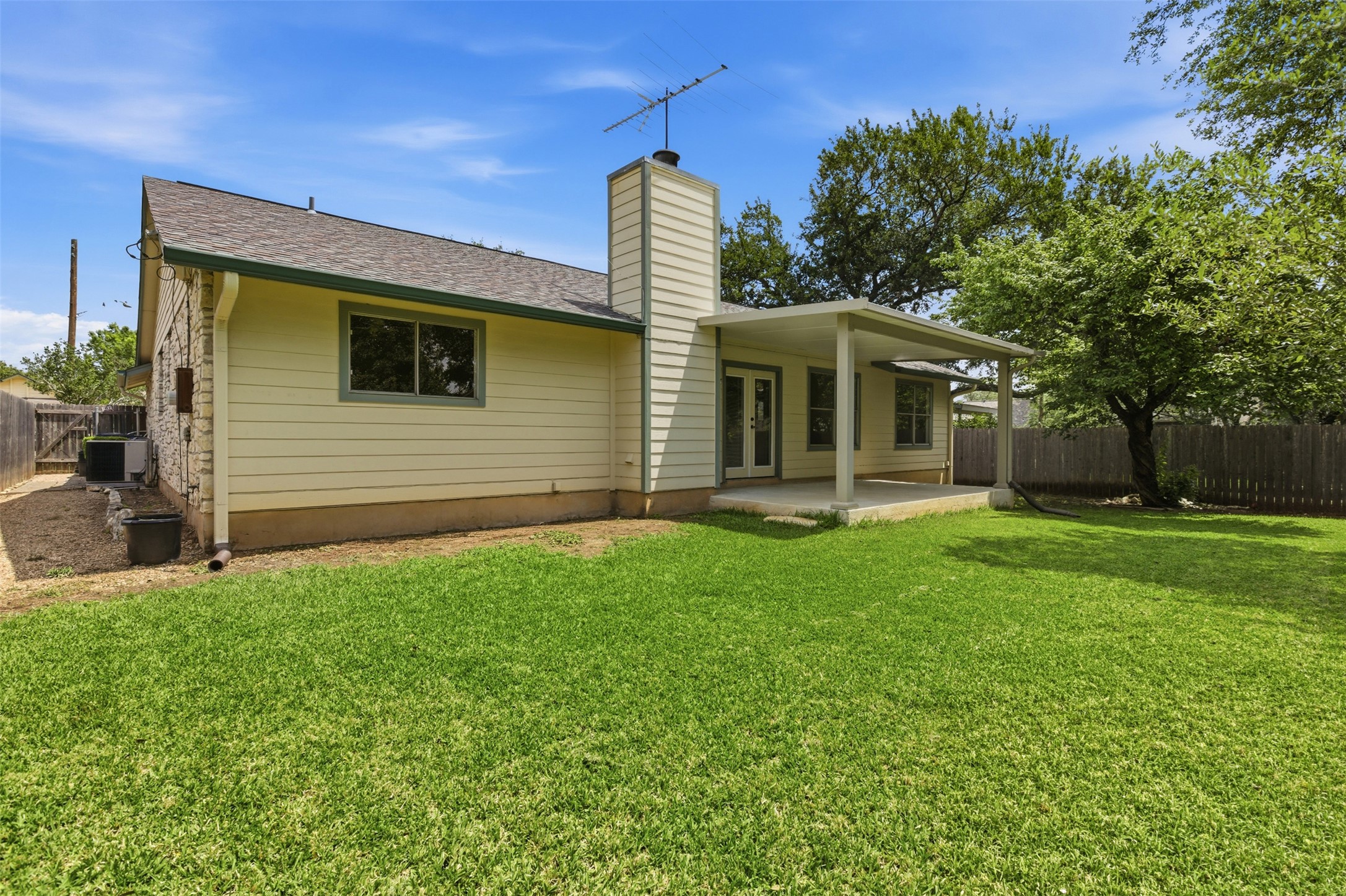 5305 Wolf Run Austin, TX 78749 - Photo 37 of 37 Expansive green lawn with a covered concrete patio