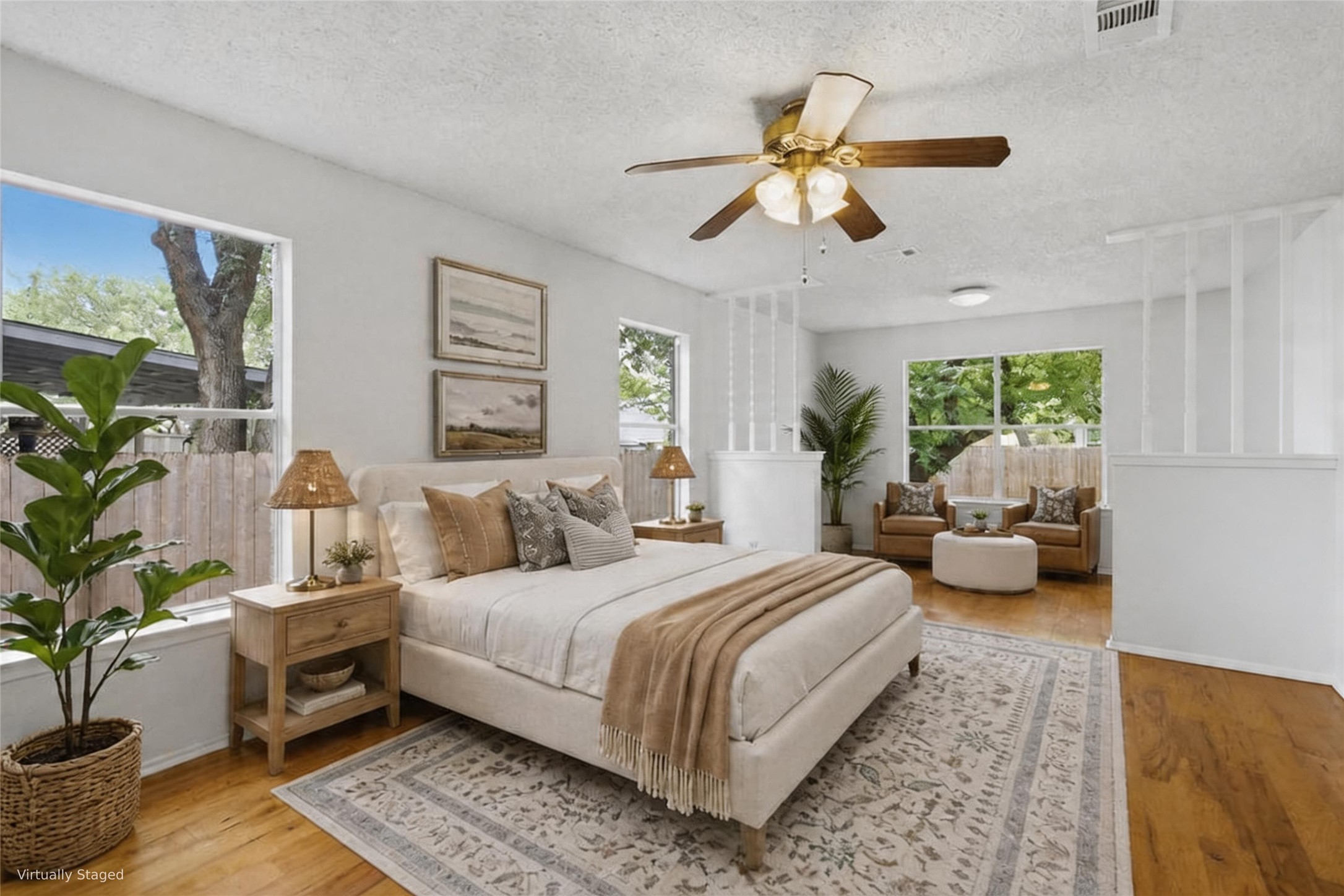 5305 Wolf Run Austin, TX 78749 - Photo 7 of 37 Spacious bedroom featuring wood-finish flooring, multiple windows, a ceiling fan with integrated lighting, and a partial wall divider