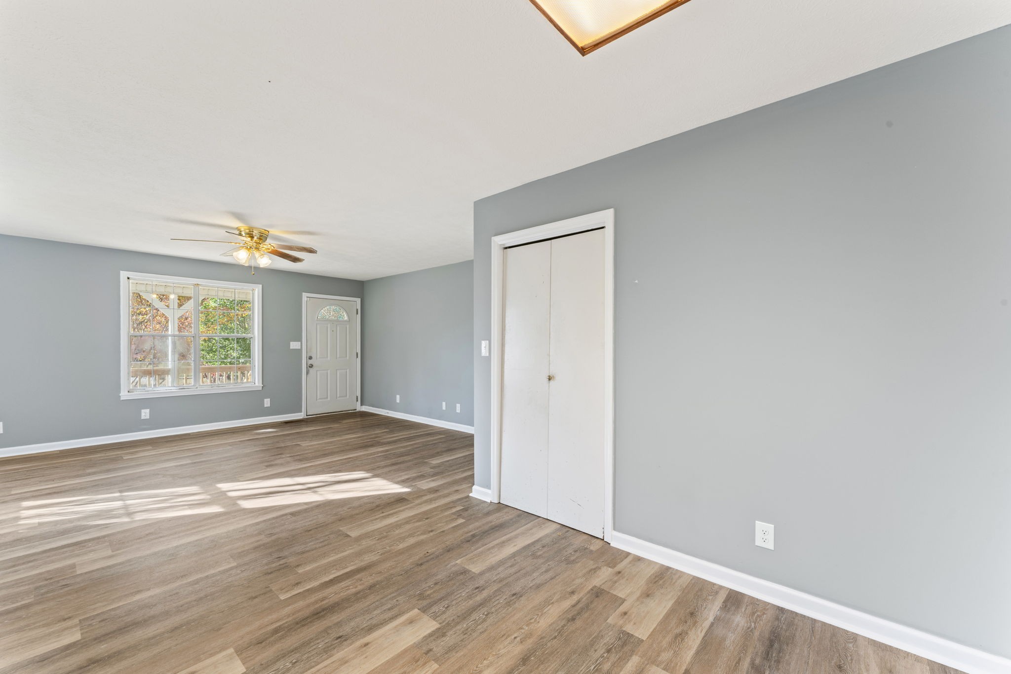 7736 Dice Lampley Road Fairview, TN 37062 - Photo 14 of 27 wooden floor in an empty room with a window
