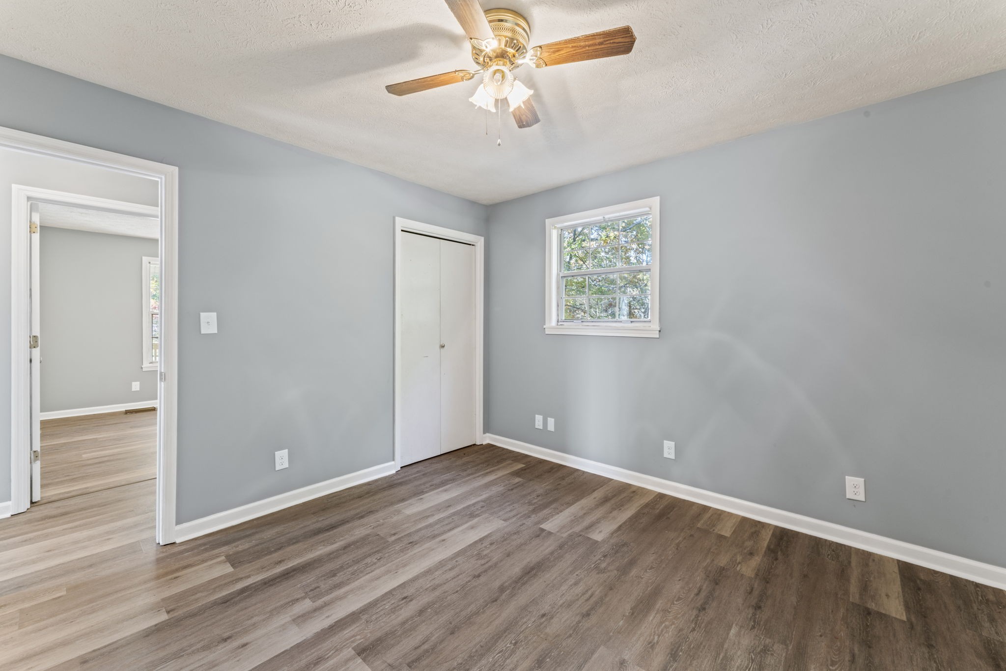7736 Dice Lampley Road Fairview, TN 37062 - Photo 18 of 27 wooden floor in an empty room with a window