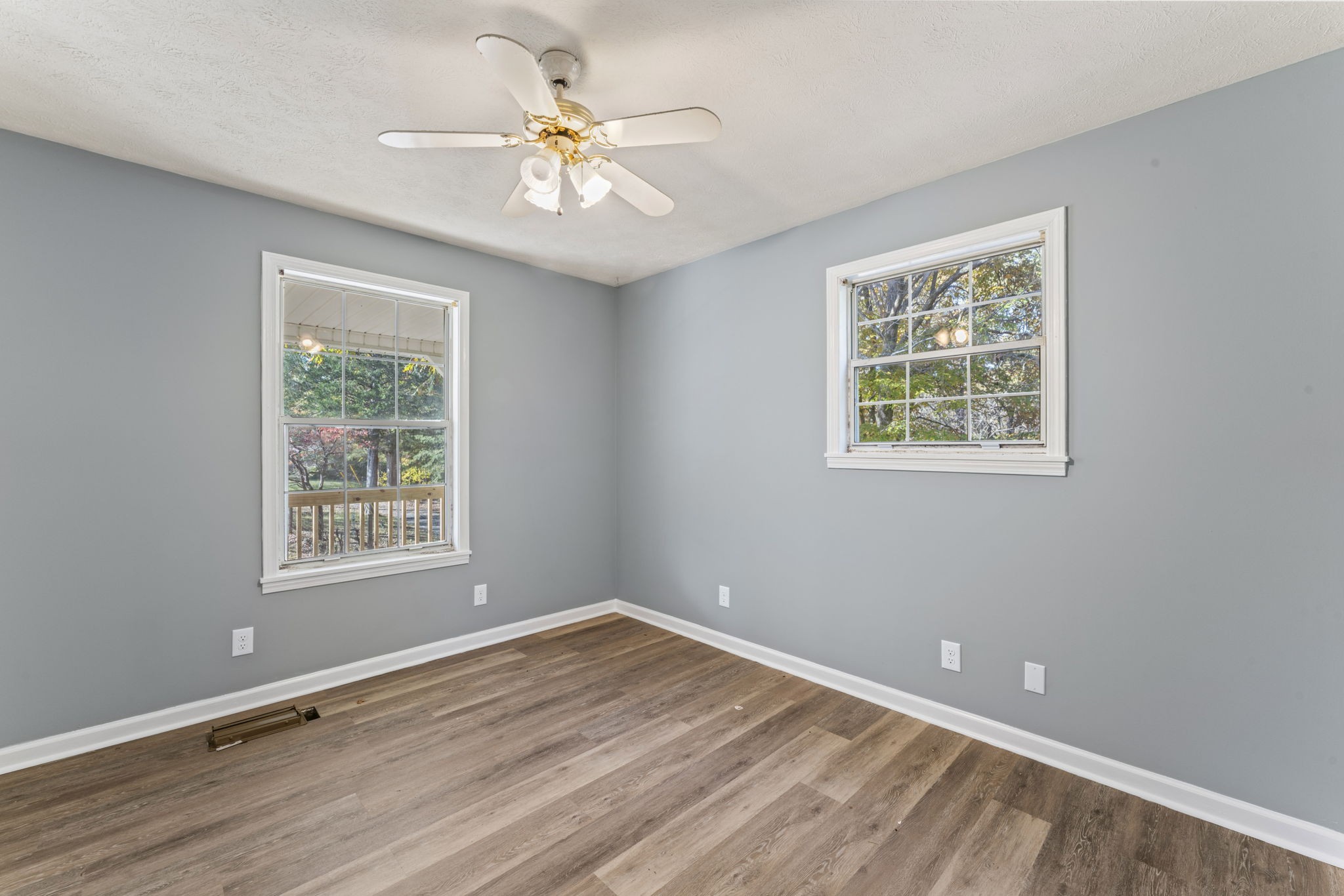 7736 Dice Lampley Road Fairview, TN 37062 - Photo 20 of 27 a view of an empty room with a window and wooden floor