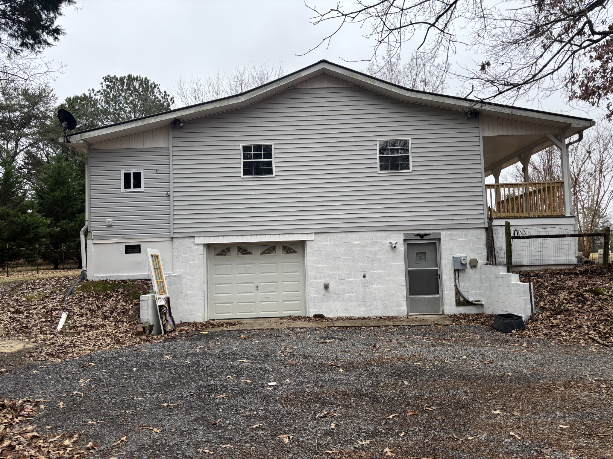 7736 Dice Lampley Road Fairview, TN 37062 - Photo 7 of 27 a view of a white house with a yard and garage