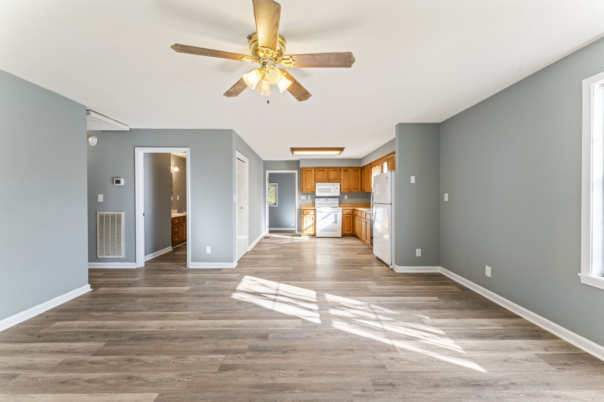 7736 Dice Lampley Road Fairview, TN 37062 - Photo 10 of 27 a view of an empty room with wooden floor and a window