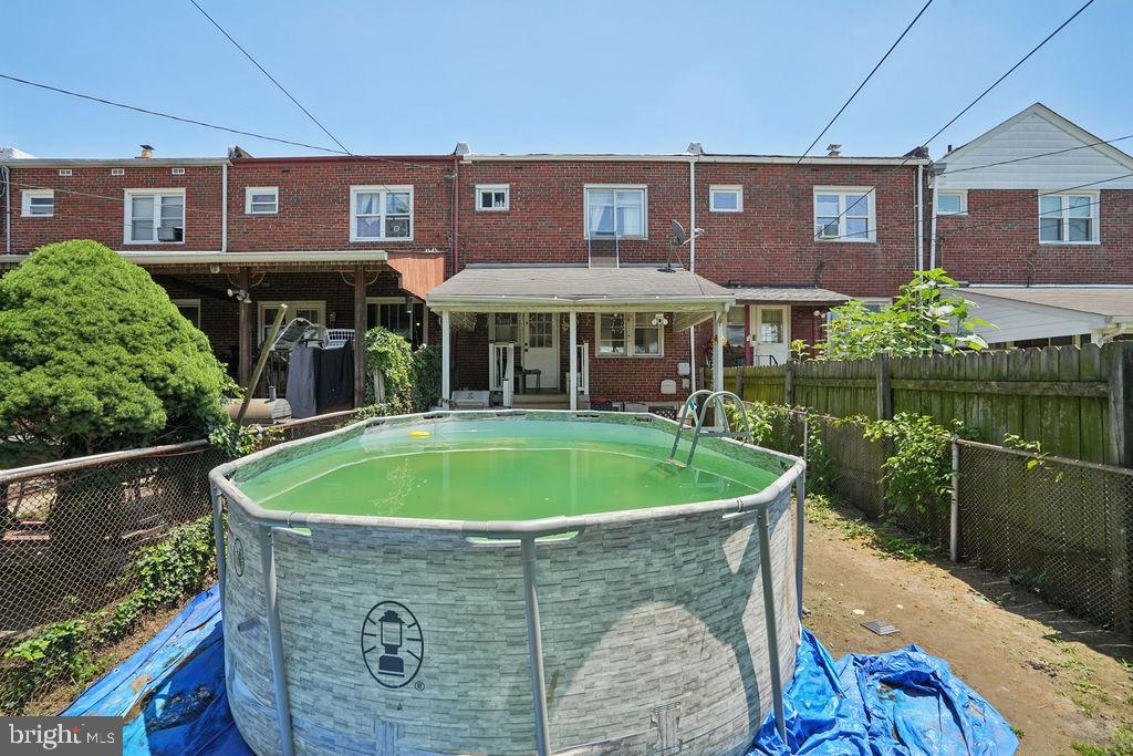 1918 Church Road Baltimore, MD 21222 - Photo 24 of 29 a view of a brick house with a swimming pool