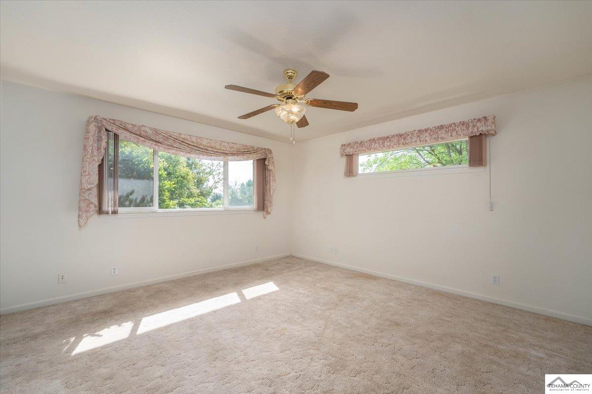 19950 Red Bank Road Red Bluff, CA 96080 - Photo 17 of 69 an empty room with windows and fan