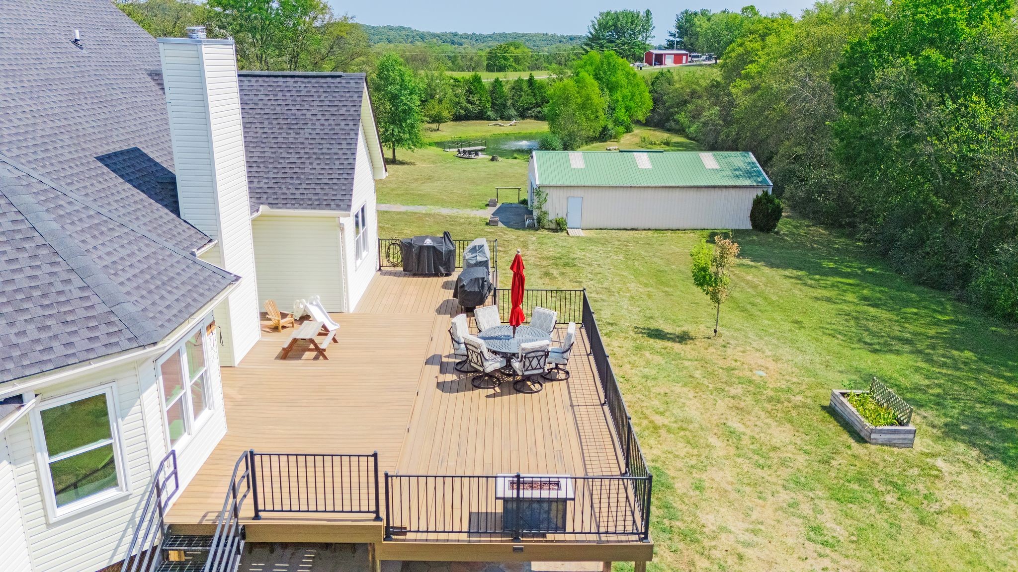 1055 Franklin Road Gallatin, TN 37066 - Photo 13 of 60 a view of a swimming pool with a patio and garden