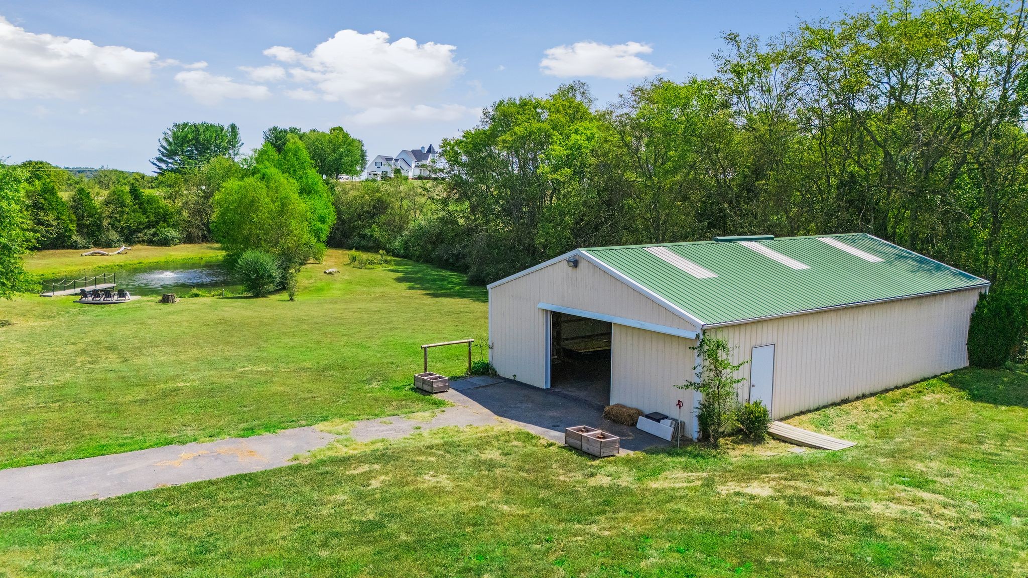 1055 Franklin Road Gallatin, TN 37066 - Photo 16 of 60 a aerial view of a house with a yard table and chairs