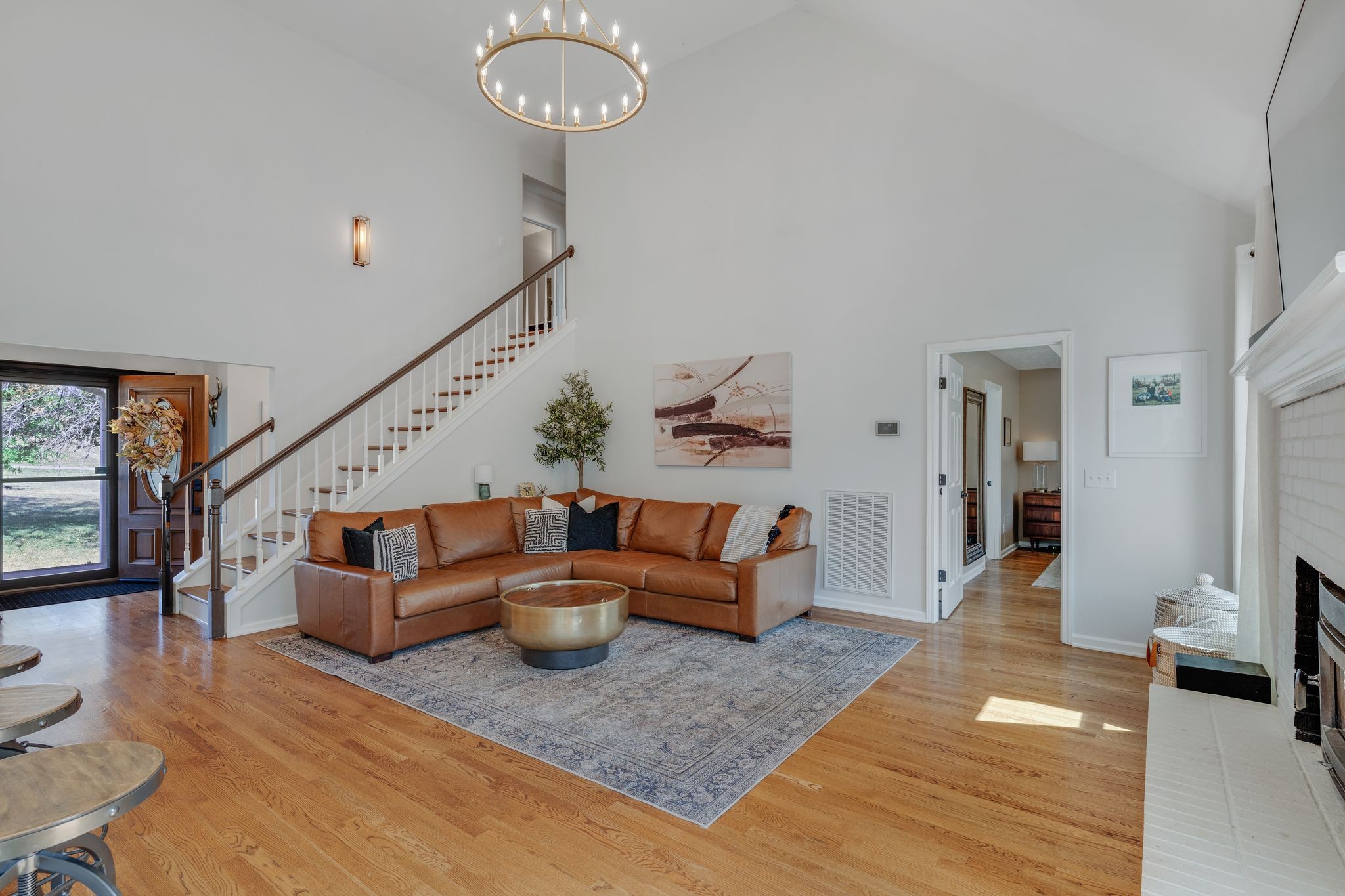 1055 Franklin Road Gallatin, TN 37066 - Photo 24 of 60 a living room with furniture and a chandelier