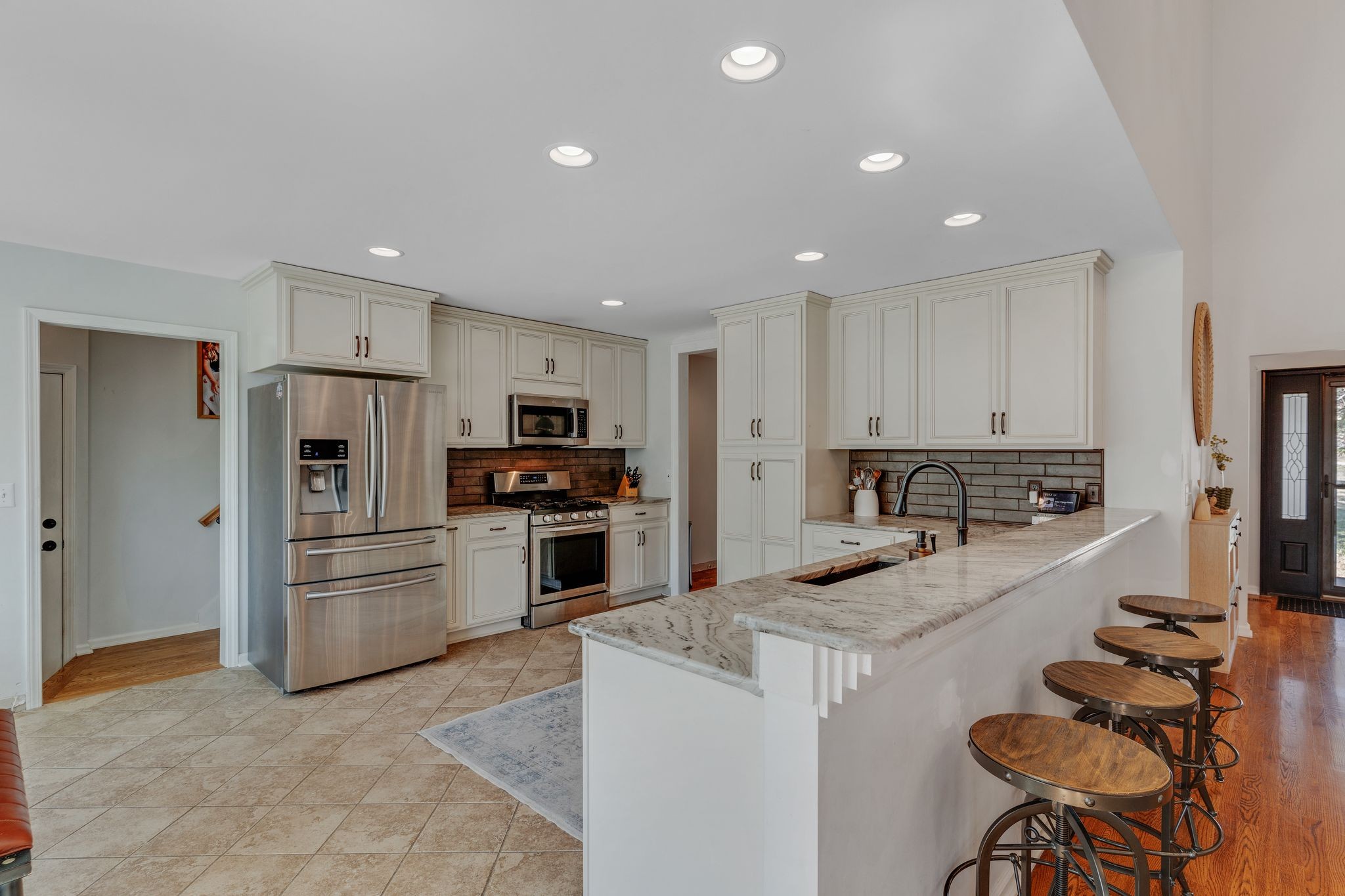 1055 Franklin Road Gallatin, TN 37066 - Photo 27 of 60 a kitchen with refrigerator cabinets and furniture