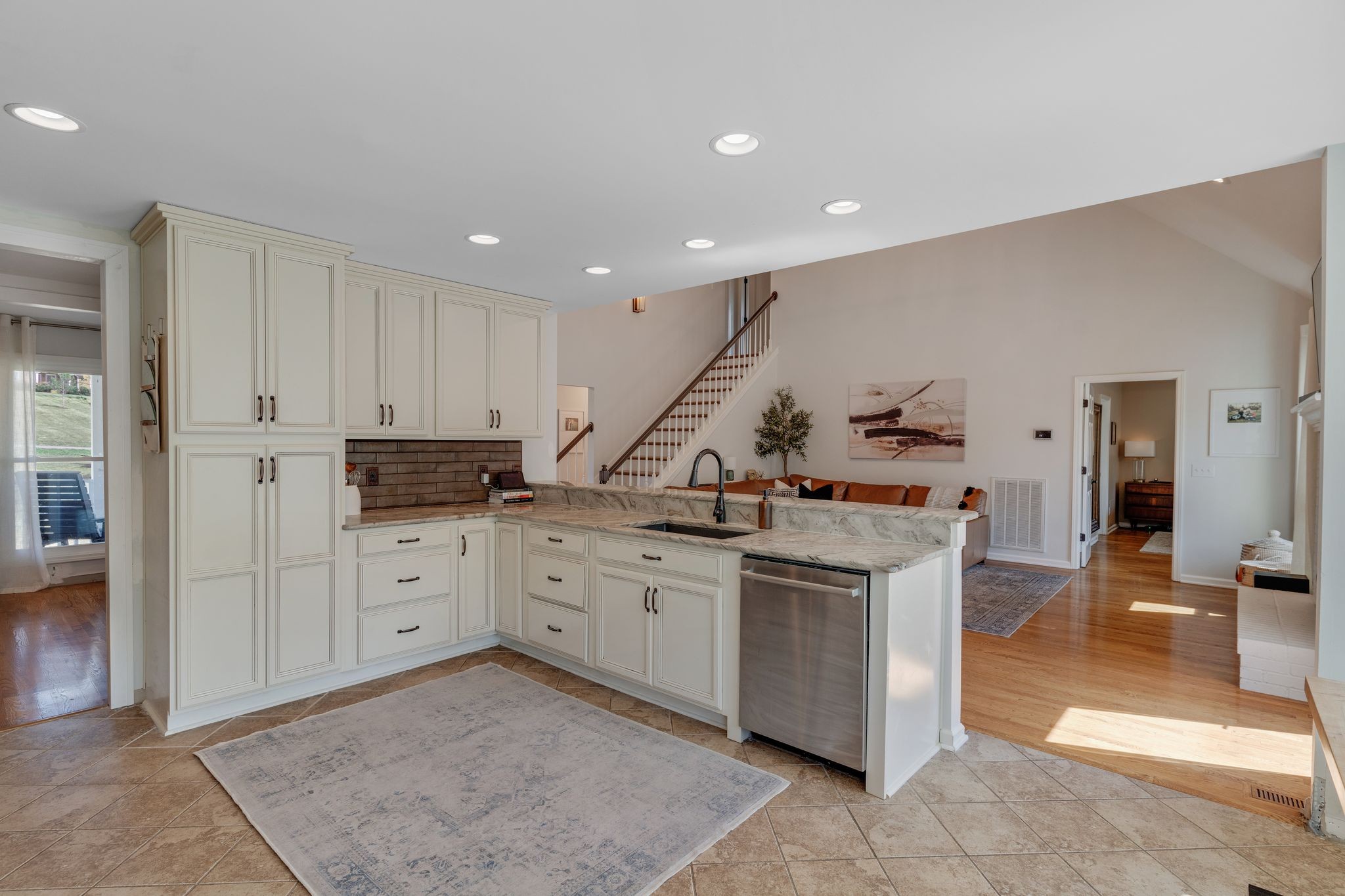 1055 Franklin Road Gallatin, TN 37066 - Photo 28 of 60 a kitchen that has a lot of cabinets in it and wooden floors